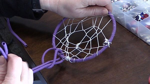 adding paracord tails to a dream catcher