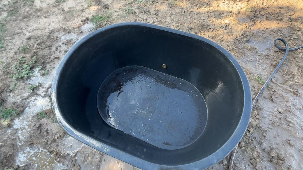 How to clean a horse water tank